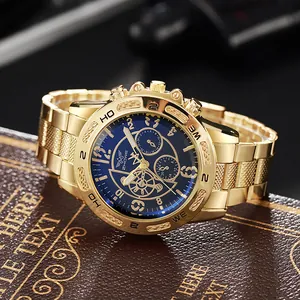 Macro shot of gold stainless steel watch band and blue chronograph dial with three sub-dials
