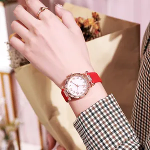 Women's rose gold starfish watch with red leather strap and sparkling rhinestone bezel