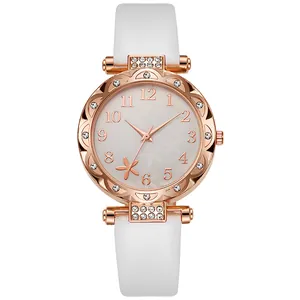 Close-up of rose gold watch case featuring rhinestone bezel and floral patterned dial