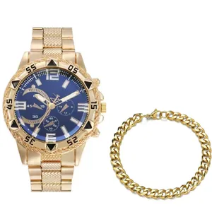 Detail of men's gold quartz watch with blue dial and matching cuban link bracelet set