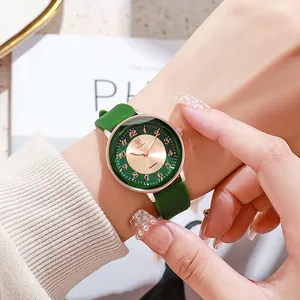 Green silicone strap fashion watch with rose gold case and green textured dial on wrist