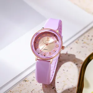 Detail of light purple silicone watch strap with rose gold case and faceted glass