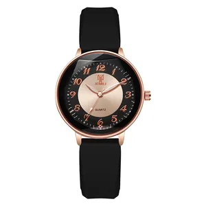 Detail of rose gold case and black silicone strap on stylish quartz women's watch