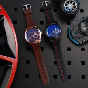 Racing style men's watch detail with silicone strap and Roman numeral dial on metal board