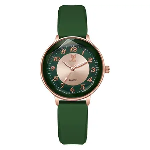 Macro detail of the diamond-cut glass edge and green dial of the quartz fashion watch