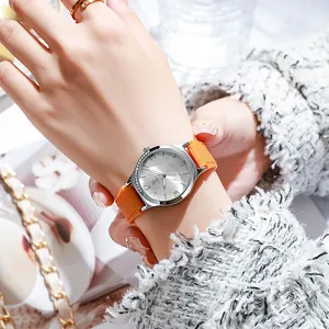 Women's quartz watch with orange silicone strap and silver rhinestone bezel