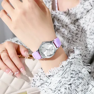 Women's quartz watch with purple silicone strap, rhinestone bezel and floral dial
