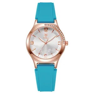 Women's quartz watch with blue silicone strap and rose gold floral dial accents