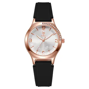 Women's rose gold fashion watch with black silicone strap and floral dial pattern
