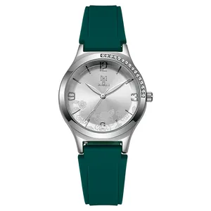 Detailed macro view of the silver sunray dial with floral patterns and green silicone strap