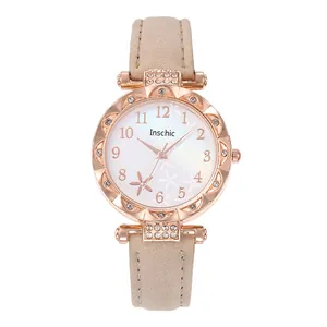Elegant rose gold women's quartz watch with beige suede strap and floral star dial