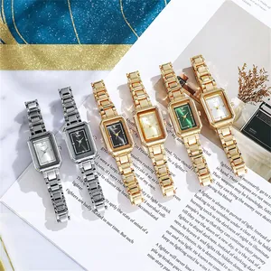 Detailed view of six rectangular women's watches with metallic bands in various colors
