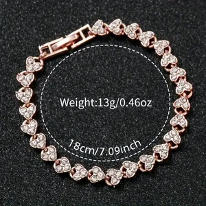 Rose gold heart chain bracelet with white rhinestones and size measurements