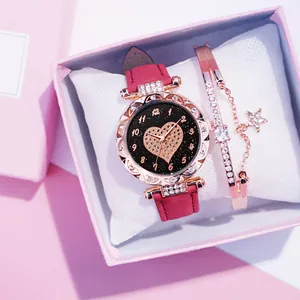 Orologio al quarzo con cinturino rosa, quadrante a cuore in strass e bracciale stella