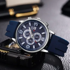 Detail of blue silicone strap watch with silver metal case and multi-dial chronograph