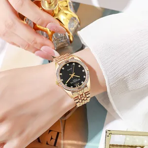 Elegant gold quartz watch for women with rhinestone bezel and black dial on female wrist