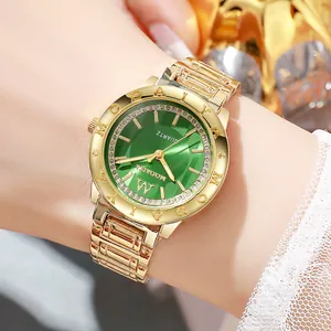 Detailed close-up of a women's gold quartz watch with a green sunray dial and crystals