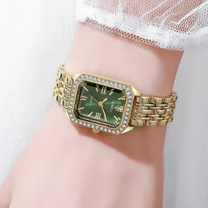 Close-up of elegant square green dial watch with gold roman numerals and crystal bezel