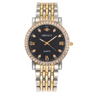Detailed macro view of quartz watch dial with diamond bezel and silver gold steel strap