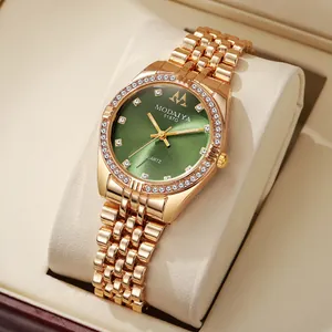 Detail of luxury green dial watch with rhinestone hour markers and crystal bezel