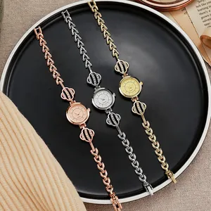 Three minimalist women quartz watches in rose gold, silver, and gold with rhinestone accents