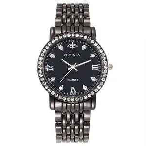 Close-up of black dial quartz watch featuring a diamond-set bezel and metal link bracelet