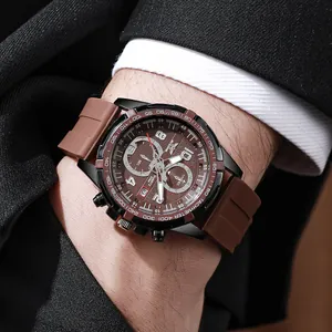 Detailed view of men's brown silicone watch with tachymeter bezel on a wrist