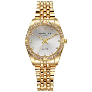 Luxury women's quartz watch with crystal indices and gold chain strap in a studio shot
