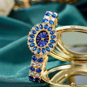 Montre à quartz de luxe pour femme avec strass bleus et motifs floraux sur soie verte