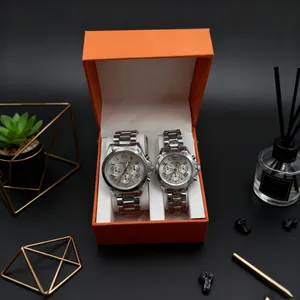Elegant stainless steel couple watches set in orange gift box with Roman numeral dials