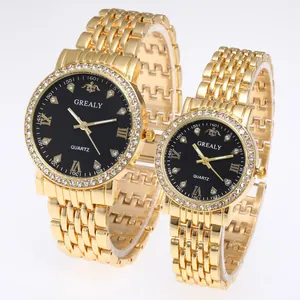 Close-up of golden quartz watches with diamond bezels and five-link steel bands