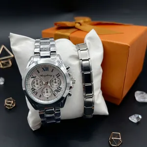 Silver stainless steel chronograph watch and bracelet set on display cushion