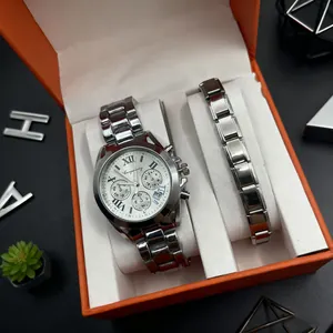 Detail of silver steel watch and bracelet set inside an orange gift box with Roman numerals