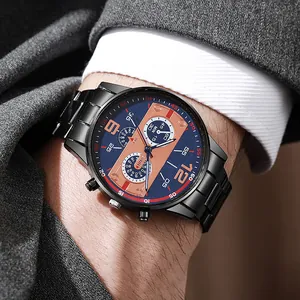 Detail of business quartz watch with blue dial on man in a grey suit and white shirt