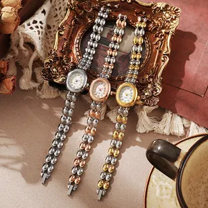 Montre Bracelet à Quartz pour Femme Élégante Cadran Ovale en Strass Alliage Chaîne de Perles Métalliques Montre Bijou Élégant pour Femme