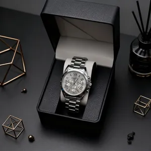 Detail of silver stainless steel chronograph watch with Roman numerals and gift box