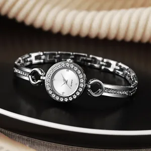 Elegant silver quartz watch for women featuring a crystal bezel and dainty chain bracelet