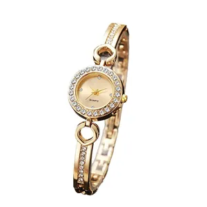 Elegant gold quartz bracelet watch for women featuring a rhinestone bezel and open bangle