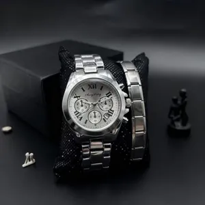 Detail of silver stainless steel men's watch with Roman numeral dial and matching bracelet