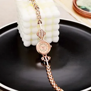 Women's rose gold quartz watch with rhinestone heart bracelet strap and round dial