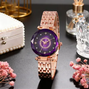 Detail of rose gold watch featuring purple gradient dial and faceted geometric glass