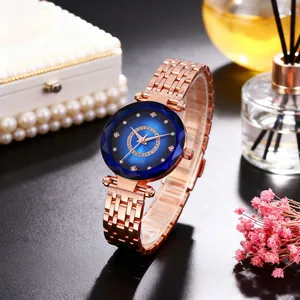 Close-up of starry blue dial quartz watch with rose gold strap and luxury gift decor
