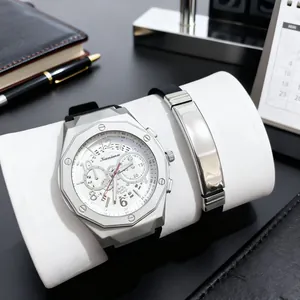 Men's business watch set with silver octagonal bezel and black silicone strap on office desk