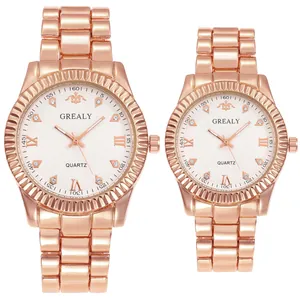 Detail of rose gold quartz watches with fluted bezel and crystal hour markers