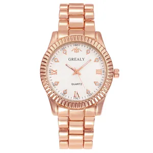 Detail view of rose gold steel watch featuring a fluted bezel and crystal markers