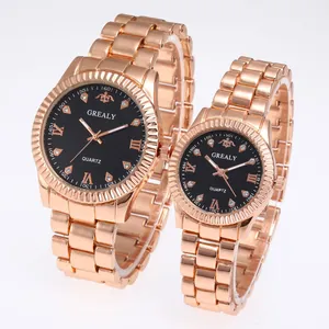 Detail of rose gold quartz watch with black textured dial and Roman numeral crystal markers