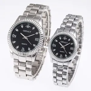 Close-up of silver steel quartz couple watches with black dial and diamond hour markers