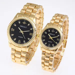 Macro view of gold quartz watches with black dial and diamond-set markers for couples