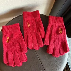 Winter red knitted gloves with golden Chinese embroidery for warmth and luck