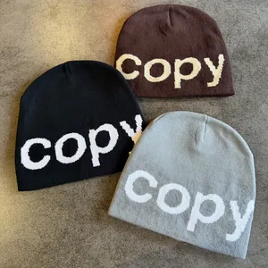 Knitted beanie set in black brown and grey featuring copy letter jacquard design